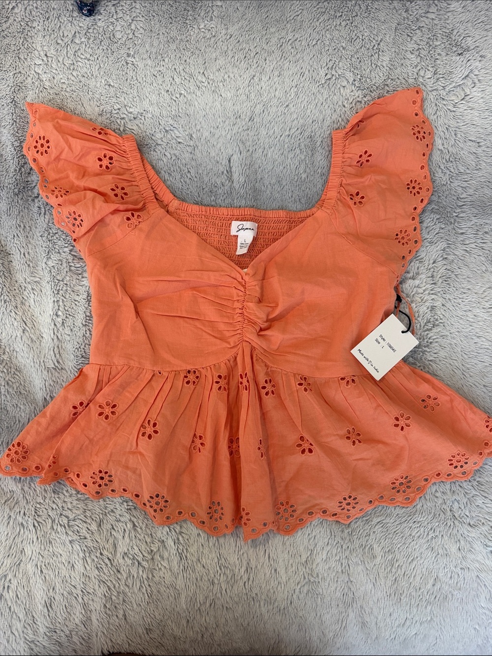 Smocked Coral Eyelet Peplum Blouse with Flutter Sleeves